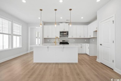 Fall in love with this move-in ready 4-bedroom, 2.5-bath home in on Tidewater Golf Club and Plantation in South Carolina - for sale on GolfHomes.com, golf home, golf lot