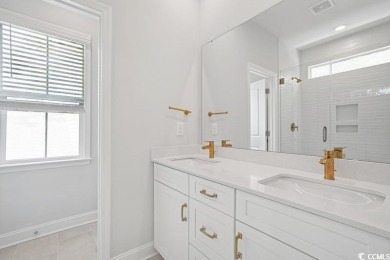 Fall in love with this move-in ready 4-bedroom, 2.5-bath home in on Tidewater Golf Club and Plantation in South Carolina - for sale on GolfHomes.com, golf home, golf lot