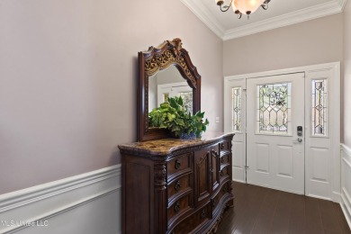 Enjoy timeless elegance and custom craftsmanship in this on Diamondhead Country Club in Mississippi - for sale on GolfHomes.com, golf home, golf lot