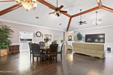 Enjoy timeless elegance and custom craftsmanship in this on Diamondhead Country Club in Mississippi - for sale on GolfHomes.com, golf home, golf lot
