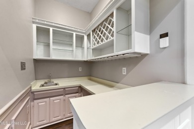 Enjoy timeless elegance and custom craftsmanship in this on Diamondhead Country Club in Mississippi - for sale on GolfHomes.com, golf home, golf lot