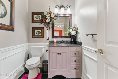 Enjoy timeless elegance and custom craftsmanship in this on Diamondhead Country Club in Mississippi - for sale on GolfHomes.com, golf home, golf lot