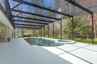 Step into elegance with this exceptional Pool Home nestled in on The Grand Club Cypress Course in Florida - for sale on GolfHomes.com, golf home, golf lot