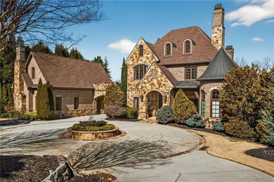 Perfectly positioned to capture sweeping views of the lake and on Manor Golf and Country Club in Georgia - for sale on GolfHomes.com, golf home, golf lot