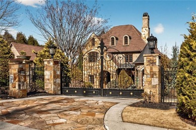 Perfectly positioned to capture sweeping views of the lake and on Manor Golf and Country Club in Georgia - for sale on GolfHomes.com, golf home, golf lot