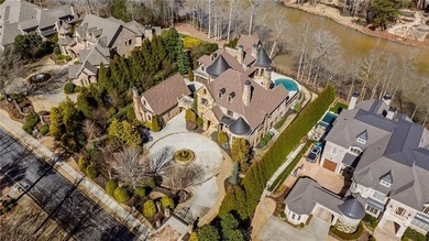 Perfectly positioned to capture sweeping views of the lake and on Manor Golf and Country Club in Georgia - for sale on GolfHomes.com, golf home, golf lot