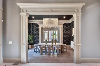 Perfectly positioned to capture sweeping views of the lake and on Manor Golf and Country Club in Georgia - for sale on GolfHomes.com, golf home, golf lot