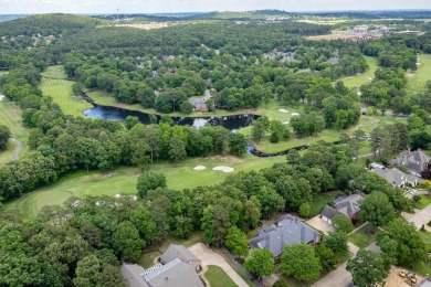 This stunning custom home on the prestigious Founder's Course of on Chenal Country Club - Bear Den Mountain in Arkansas - for sale on GolfHomes.com, golf home, golf lot