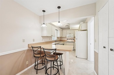 Enjoy effortless Florida living in this fully furnished on Falcon Watch Golf Club in Florida - for sale on GolfHomes.com, golf home, golf lot