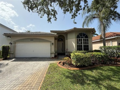 Gorgeous single-story Mediterranean-style pool home in the gated on TPC Eagle Trace in Florida - for sale on GolfHomes.com, golf home, golf lot
