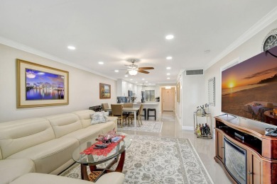 Enjoy a full lake view from extended living area in this 2/2 on Fountains Golf and Country Club in Florida - for sale on GolfHomes.com, golf home, golf lot