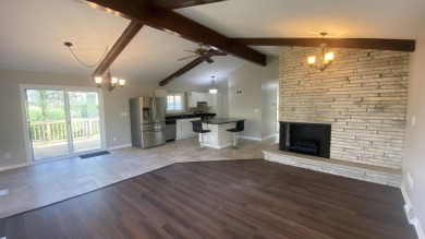 Welcome home to this Beautiful updated 4 bedroom, 2 bath home on Lakes of the Four Seasons Country Club in Indiana - for sale on GolfHomes.com, golf home, golf lot