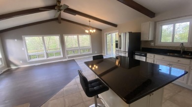 Welcome home to this Beautiful updated 4 bedroom, 2 bath home on Lakes of the Four Seasons Country Club in Indiana - for sale on GolfHomes.com, golf home, golf lot