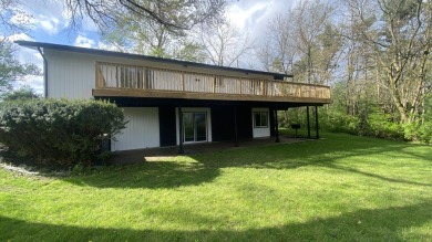 Welcome home to this Beautiful updated 4 bedroom, 2 bath home on Lakes of the Four Seasons Country Club in Indiana - for sale on GolfHomes.com, golf home, golf lot