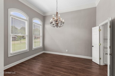 Welcome to this fantastic home on a spacious corner lot, just on Lake Caroline Golf Club in Mississippi - for sale on GolfHomes.com, golf home, golf lot
