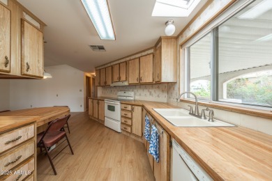 Nicely maintained home. Vinyl plank flooring in entry, kitchen on Oakwood Golf Club  in Arizona - for sale on GolfHomes.com, golf home, golf lot
