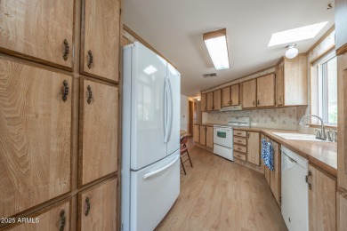 Nicely maintained home. Vinyl plank flooring in entry, kitchen on Oakwood Golf Club  in Arizona - for sale on GolfHomes.com, golf home, golf lot