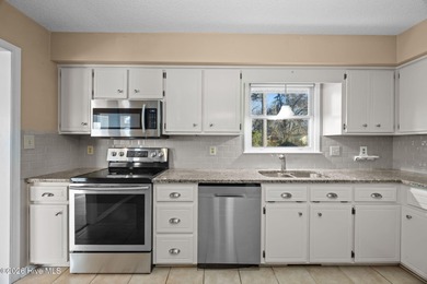 Welcome home to this 3-bedroom, 2-bath residence in the on River Bend Golf and Country Club in North Carolina - for sale on GolfHomes.com, golf home, golf lot