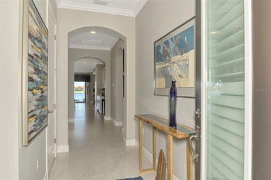 Discover the epitome of luxury living in this stunning Key Largo on Sarasota National Golf Club in Florida - for sale on GolfHomes.com, golf home, golf lot