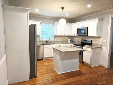 No HOA - Discover the perfect blend of contemporary elegance and on Charlie Yates Golf Course in Georgia - for sale on GolfHomes.com, golf home, golf lot