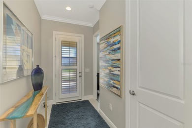 Discover the epitome of luxury living in this stunning Key Largo on Sarasota National Golf Club in Florida - for sale on GolfHomes.com, golf home, golf lot