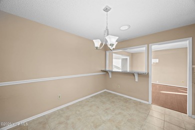 Welcome home to this 3-bedroom, 2-bath residence in the on River Bend Golf and Country Club in North Carolina - for sale on GolfHomes.com, golf home, golf lot