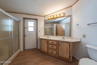 Nicely maintained home. Vinyl plank flooring in entry, kitchen on Oakwood Golf Club  in Arizona - for sale on GolfHomes.com, golf home, golf lot