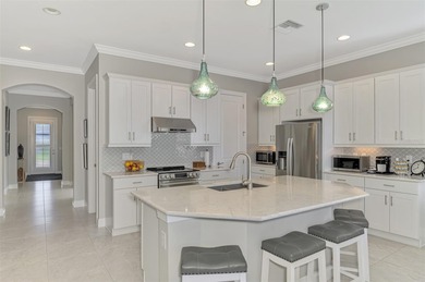 Discover the epitome of luxury living in this stunning Key Largo on Sarasota National Golf Club in Florida - for sale on GolfHomes.com, golf home, golf lot