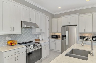 Discover the epitome of luxury living in this stunning Key Largo on Sarasota National Golf Club in Florida - for sale on GolfHomes.com, golf home, golf lot