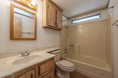 Nicely maintained home. Vinyl plank flooring in entry, kitchen on Oakwood Golf Club  in Arizona - for sale on GolfHomes.com, golf home, golf lot