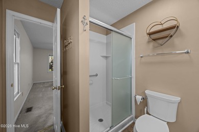 Welcome home to this 3-bedroom, 2-bath residence in the on River Bend Golf and Country Club in North Carolina - for sale on GolfHomes.com, golf home, golf lot