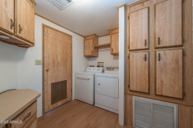 Nicely maintained home. Vinyl plank flooring in entry, kitchen on Oakwood Golf Club  in Arizona - for sale on GolfHomes.com, golf home, golf lot