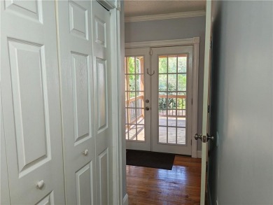 No HOA - Discover the perfect blend of contemporary elegance and on Charlie Yates Golf Course in Georgia - for sale on GolfHomes.com, golf home, golf lot