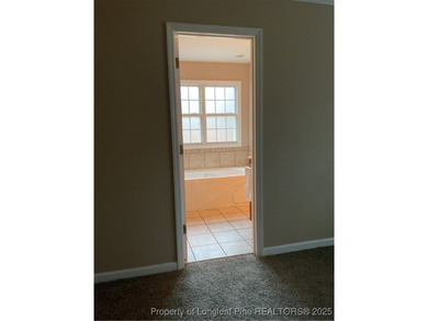 NEW PRICE/NEW PAINT AND CARPET/THIS HOME IS PRICED BELOW TAX on Carolina Trace Country Club in North Carolina - for sale on GolfHomes.com, golf home, golf lot