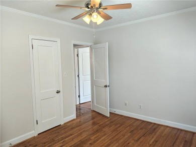 No HOA - Discover the perfect blend of contemporary elegance and on Charlie Yates Golf Course in Georgia - for sale on GolfHomes.com, golf home, golf lot