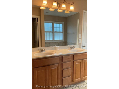 NEW PRICE/NEW PAINT AND CARPET/THIS HOME IS PRICED BELOW TAX on Carolina Trace Country Club in North Carolina - for sale on GolfHomes.com, golf home, golf lot