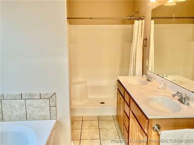 NEW PRICE/NEW PAINT AND CARPET/THIS HOME IS PRICED BELOW TAX on Carolina Trace Country Club in North Carolina - for sale on GolfHomes.com, golf home, golf lot