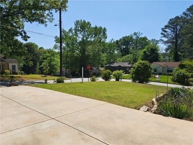 No HOA - Discover the perfect blend of contemporary elegance and on Charlie Yates Golf Course in Georgia - for sale on GolfHomes.com, golf home, golf lot