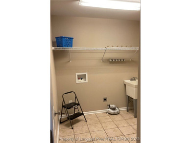 NEW PRICE/NEW PAINT AND CARPET/THIS HOME IS PRICED BELOW TAX on Carolina Trace Country Club in North Carolina - for sale on GolfHomes.com, golf home, golf lot