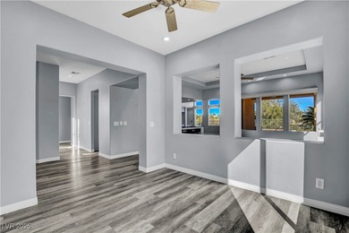 Welcome to this single-story residence located behind the gates on Red Rock Country Club in Nevada - for sale on GolfHomes.com, golf home, golf lot