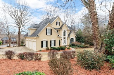 Welcome to this 5-bedroom home that sits on a corner lot and on Towne Lake Hills Golf Club in Georgia - for sale on GolfHomes.com, golf home, golf lot