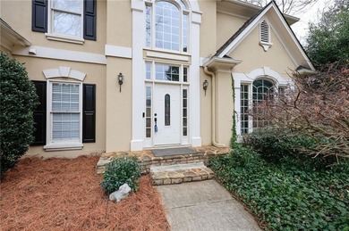 Welcome to this 5-bedroom home that sits on a corner lot and on Towne Lake Hills Golf Club in Georgia - for sale on GolfHomes.com, golf home, golf lot