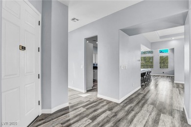 Welcome to this single-story residence located behind the gates on Red Rock Country Club in Nevada - for sale on GolfHomes.com, golf home, golf lot