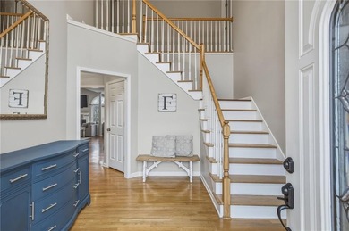 Welcome to this 5-bedroom home that sits on a corner lot and on Towne Lake Hills Golf Club in Georgia - for sale on GolfHomes.com, golf home, golf lot