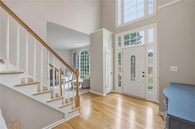 Welcome to this 5-bedroom home that sits on a corner lot and on Towne Lake Hills Golf Club in Georgia - for sale on GolfHomes.com, golf home, golf lot