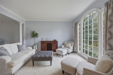 Welcome to this 5-bedroom home that sits on a corner lot and on Towne Lake Hills Golf Club in Georgia - for sale on GolfHomes.com, golf home, golf lot