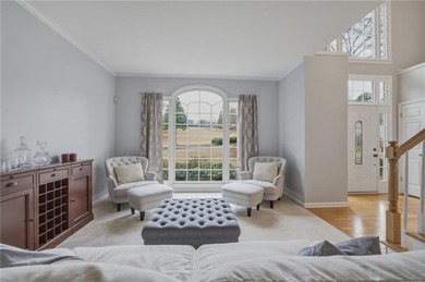 Welcome to this 5-bedroom home that sits on a corner lot and on Towne Lake Hills Golf Club in Georgia - for sale on GolfHomes.com, golf home, golf lot