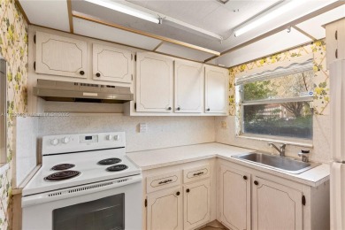 Imagine stepping out your front door and being just steps away on Sunrise Lakes Phase III in Florida - for sale on GolfHomes.com, golf home, golf lot