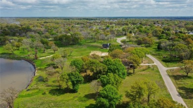 Open water lot on almost half acre in newer gated community on on Cedar Creek Country Club in Texas - for sale on GolfHomes.com, golf home, golf lot