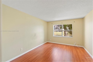 Imagine stepping out your front door and being just steps away on Sunrise Lakes Phase III in Florida - for sale on GolfHomes.com, golf home, golf lot